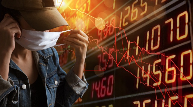 Tourism problem economy form corona virus outbreak concept. A tourist woman with business stock graph down. She paranoid world of economy finance stock graph and marketing.Depress from Circuit breaker